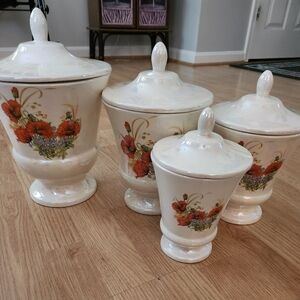 Vintage Haeger pearlescent pottery cannister set, 2 sided different flowers